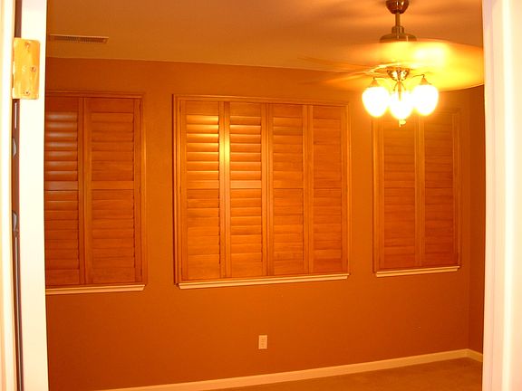 Master bedroom with wood shutters