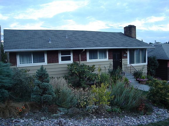 New paint, vinyl window, and professionally landscaped yard.