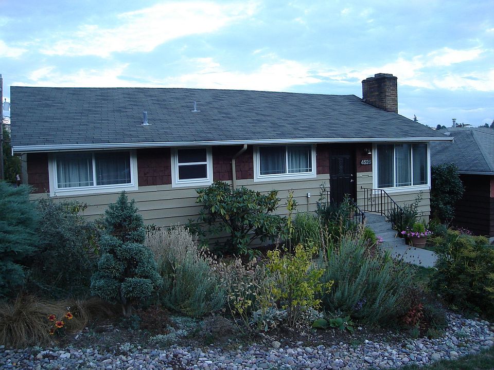 New paint, vinyl window, and professionally landscaped yard.