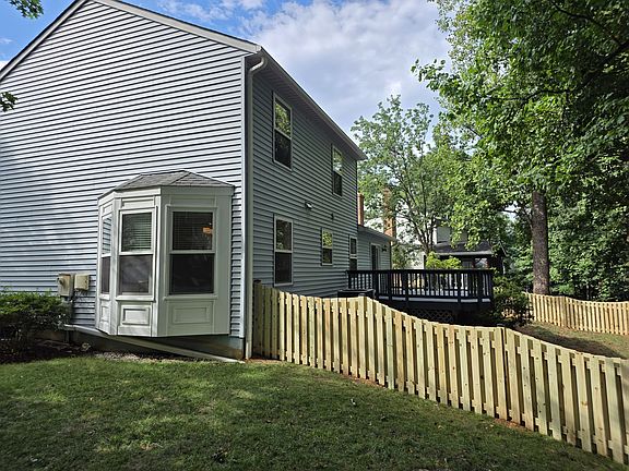 Newly fenced rear yard. Dining room with bay window. Large deck, newly repainted.