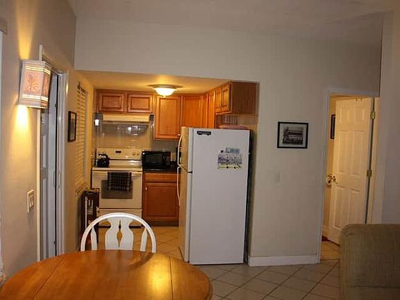 From living room toward kitchen, bathroom to right