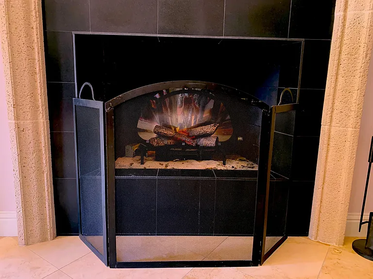 Electric fireplace provides a little heat in the cool months.