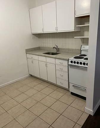 Remodeled kitchen with lots of cabinets and new appliances.