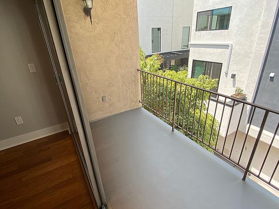 Balcony Off Living Area With Light and Outdoor Plug