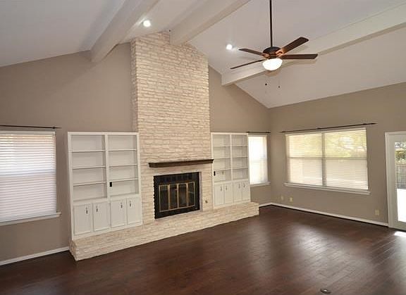 Living Room with hardwood floors, fireplace, built-in's and