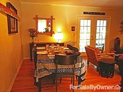 Dining Room
						:
						Room for 12 around the table, opens to kitchen and living room.