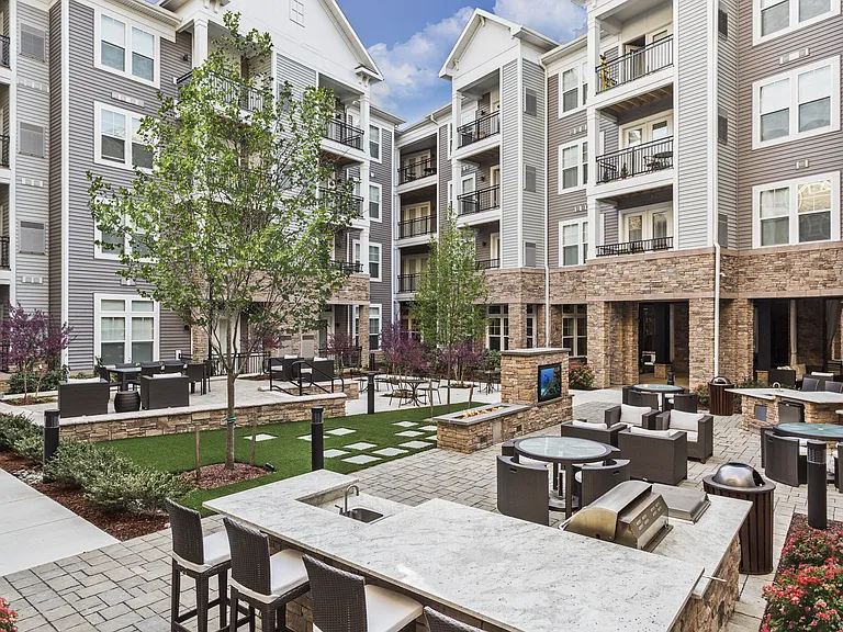 Beautifully Landscaped Courtyard with Firepits, Wet Bar, Seating Areas, Entertaining Space, and an Outdoor TV