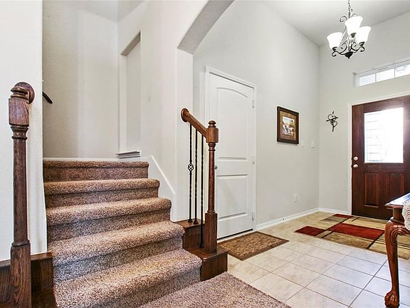 Entrance to the right, enters 3 car garage. The upstairs offers 4th bedroom, game room & full bathroom.