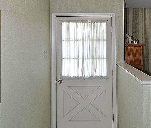 Enter the front door to the foyer.  Tile flooring complements walls and front door. Formal living room to the right of  half wall.