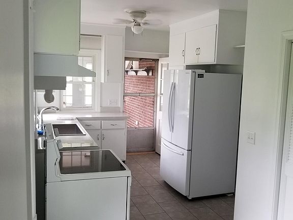 The kitchen: new floor and appliances.  Stainless sink and g