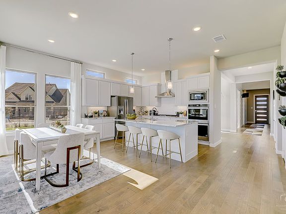 Kitchen in the Glacier II home plan by Trophy Signature Homes - REPRESENTATIVE PHOTO