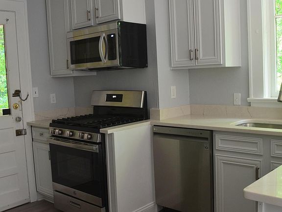 New microwave and dishwasher, sink, fixtures and counters and cabinets.