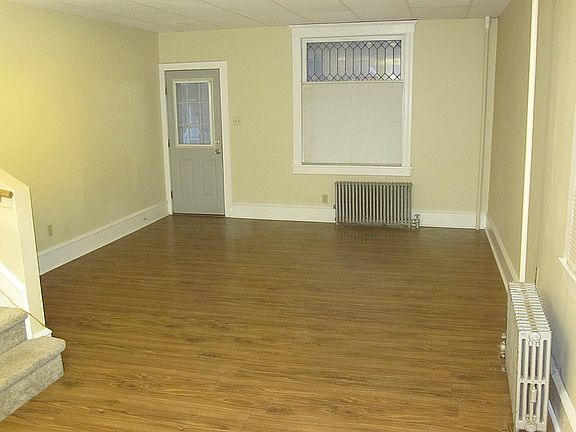Front half of the large (approximately 27 x 13 feet) living room / dining room combination space.