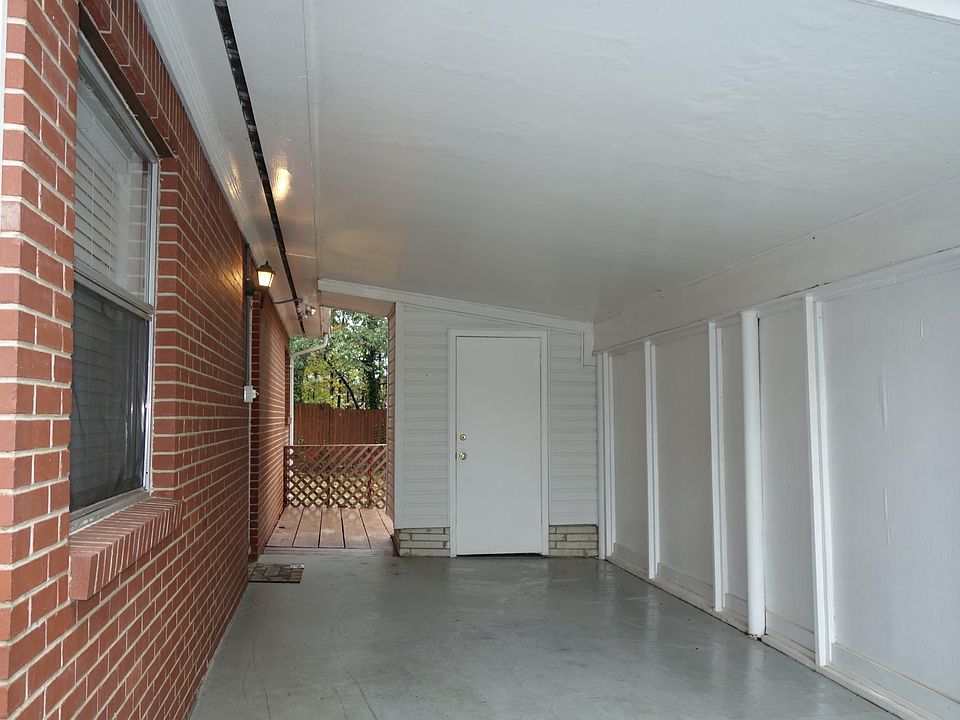 Carport by Entry Door w/Storage