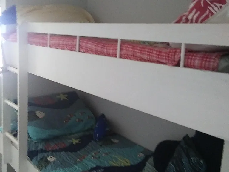Two built-in bunk beds with drawers underneath for storage.