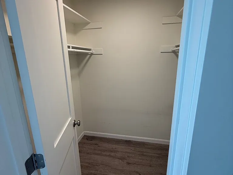 Spacious walk-in closet with built-in shelving