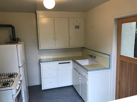 Kitchen with door to outside private patio.