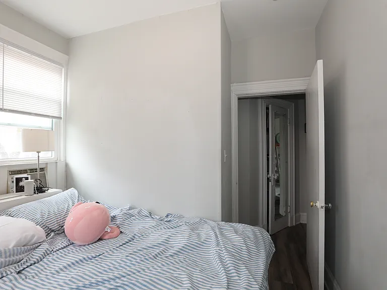 Bedroom with natural light and neutral finishes