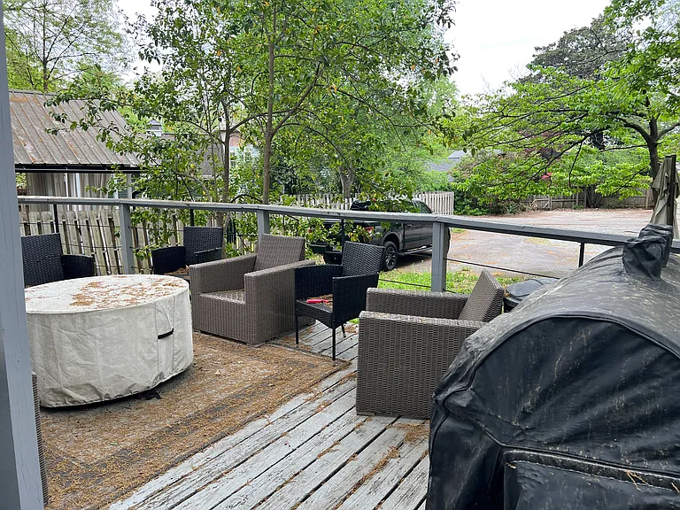 Deck with parking lot in back yard