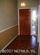 Formal entrance with wood flooring 