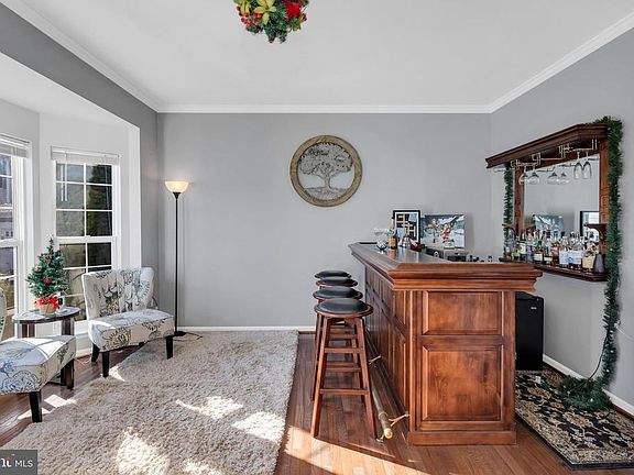 Cozy sitting room features bay window