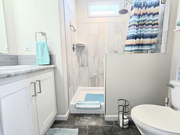 Full bath has step-in shower