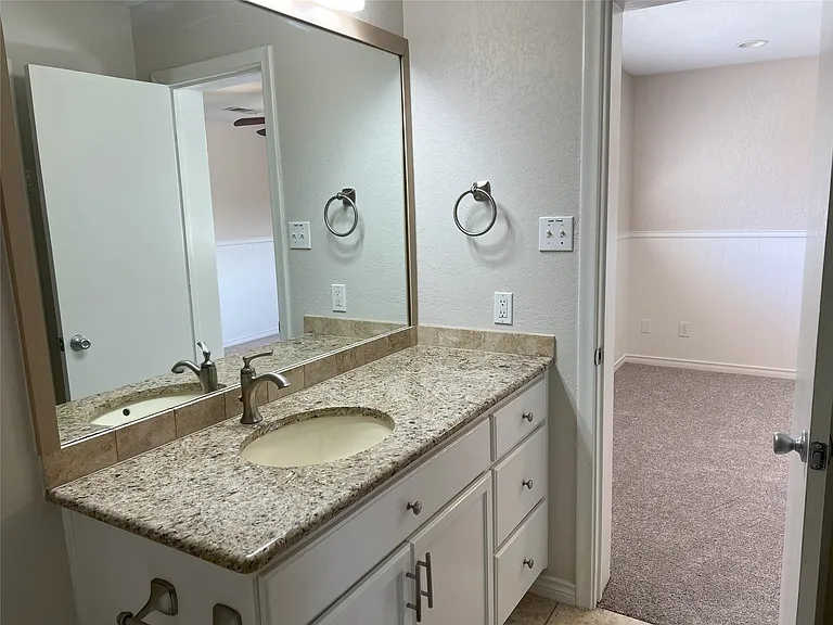 One of two bathrooms on the second floor. This one has a tub/shower and is accessible between two of the bedrooms upstairs.