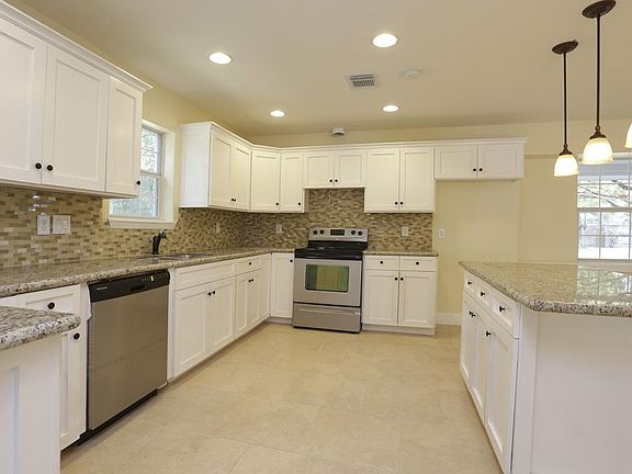 All new kitchen, appliances, cabinets and Island cooktop