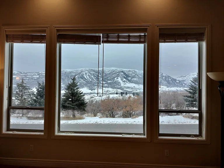 This spacious office boasts 10-foot basement ceilings, large windows for natural light, and two desks equipped with monitors and outlets for teleworking. Enjoy a treadmill for break-time exercise and a cozy fireplace to keep you comfortable.