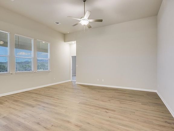 Bring together family and friends in this spacious living room.