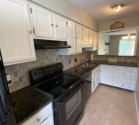 Kitchen with granite, tile backsplash and newer appliances