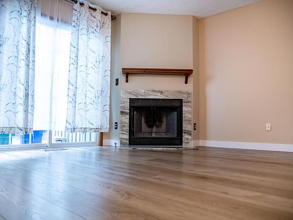 Beautiful fireplace included in living room.