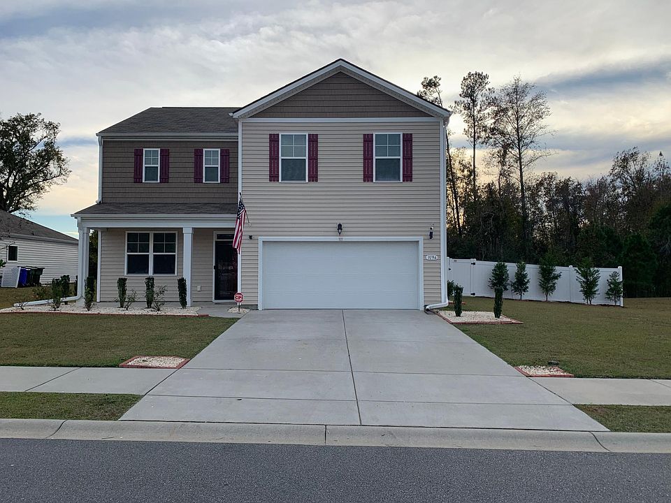 Nice home with covered front porch and two car garage!