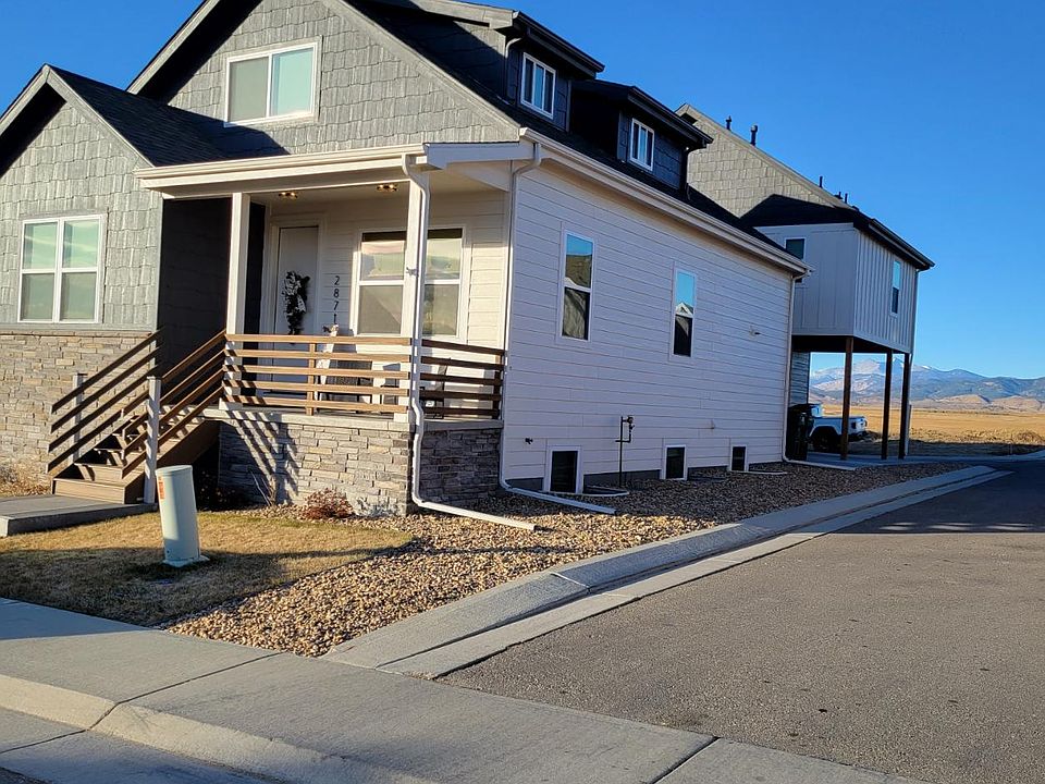 Apartment is the elevated building closest to mountains