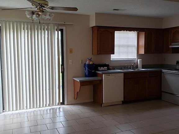 Dining area off the kitchen, showing the sliding glass door out to the patio.