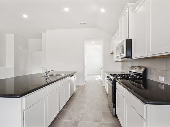 Kitchen with easy access to dining room