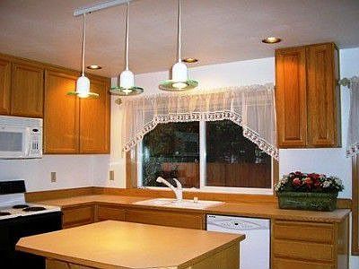 Kitchen with island and oak cabinets