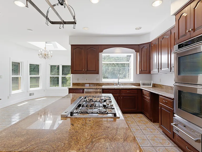 Double oven, 6-burner cook and breakfast nook.