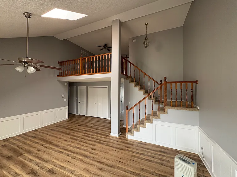 Stairs to upstairs bedroom, office area and bathroom. Laundry hook ups behind double door closet.