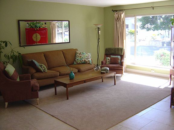 Living Room w/ Large Picture Window & Fireplace