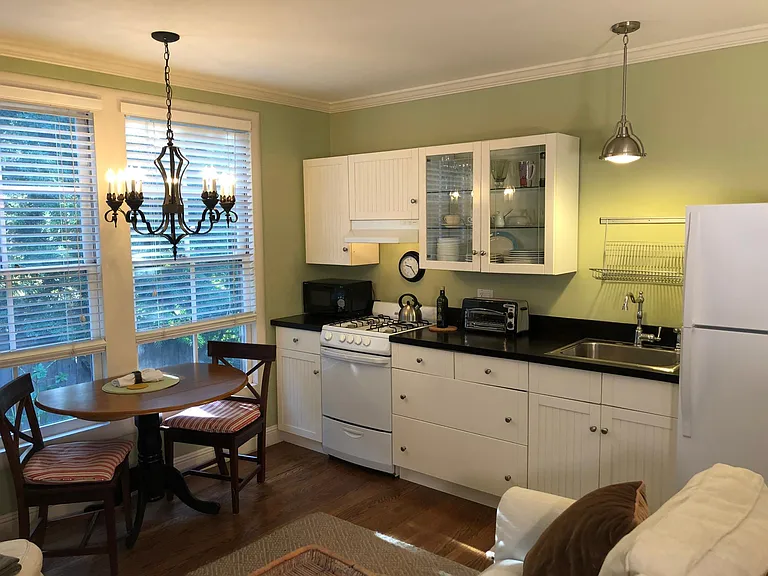 Kitchen and dining table looking from the front door.