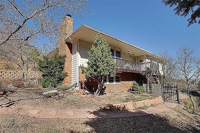 Rare raised rancher on 3/4 acre D20 cul de sac lot in Mount Woodmen Estates