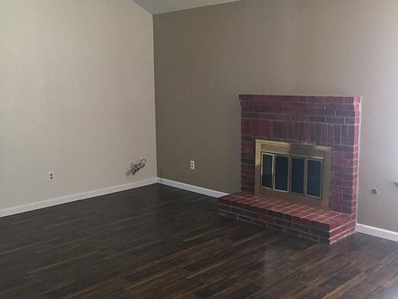 Living room with fireplace and designer accent paint