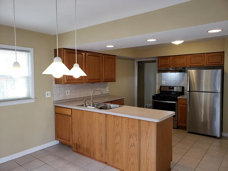 Plenty of Windows and Recessed Lights Create Light Bright Living Areas