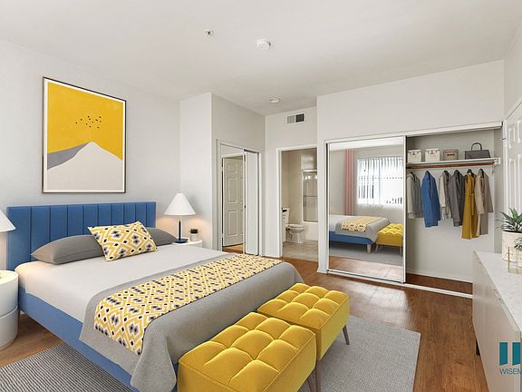 Spacious Bedroom with Two-Mirrored Closets and Bathroom