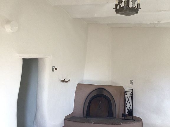 large room with Kiva fireplace