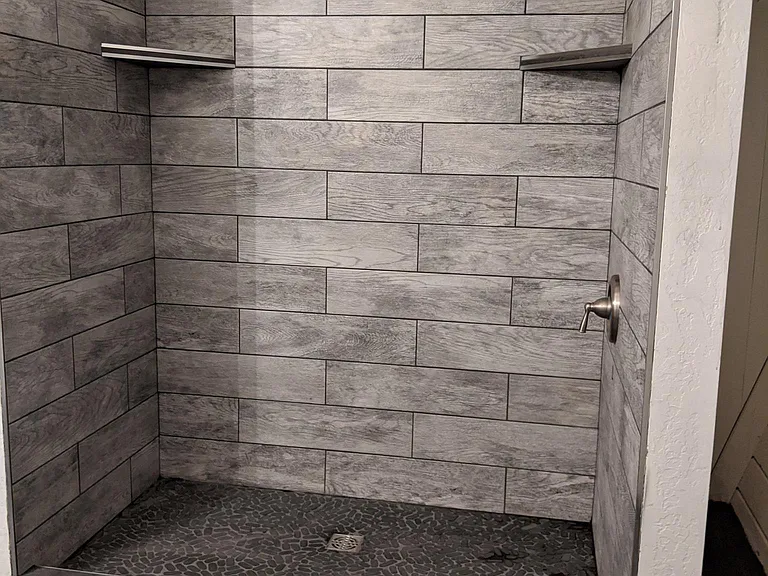 Brand New Tile Shower and floor with pebble shower pan