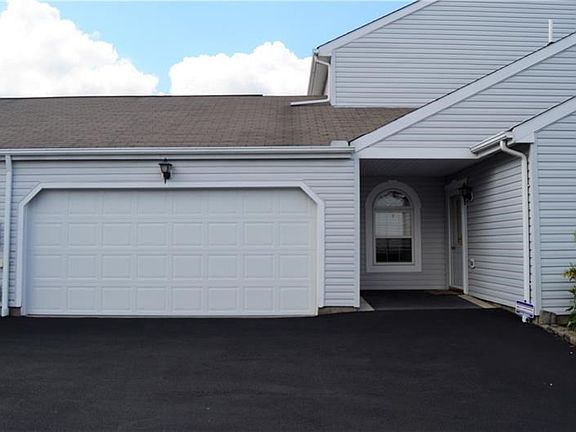 Your two car garage awaits you.  Simply pull in and walk straight into your kitchen with no steps required.
