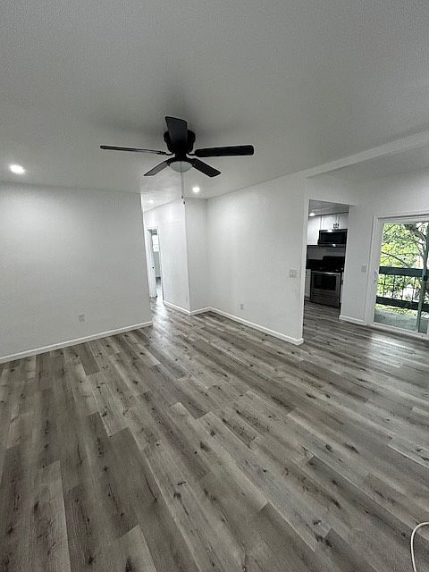 View from living room looking towards kitchen and hallway.