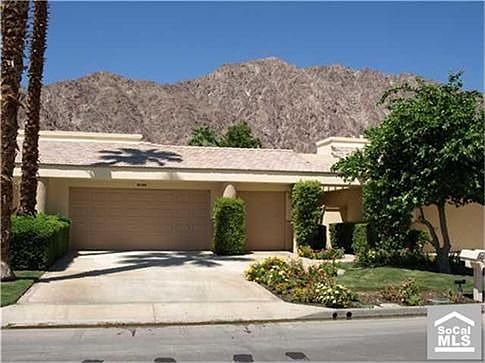 Front with 2 car garage and golf cart garage